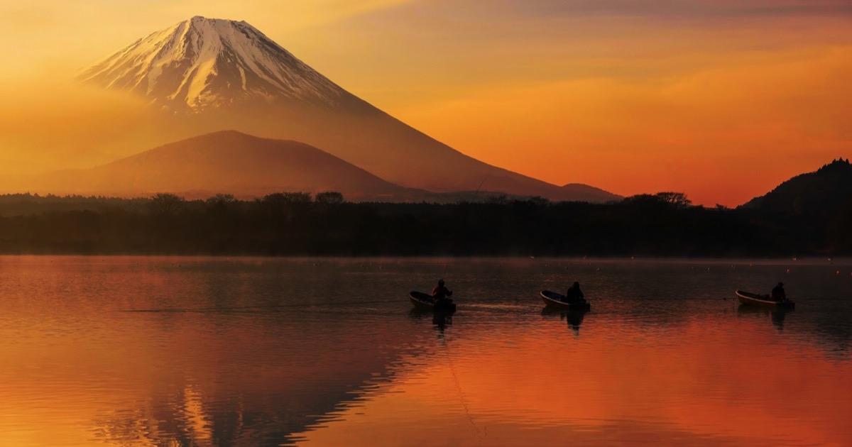 Fishing boats on a Fuji lake at sunset