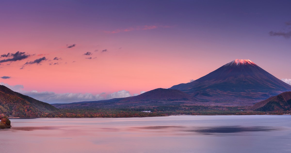 Mt. Fuji across a quiet western lake at dusk