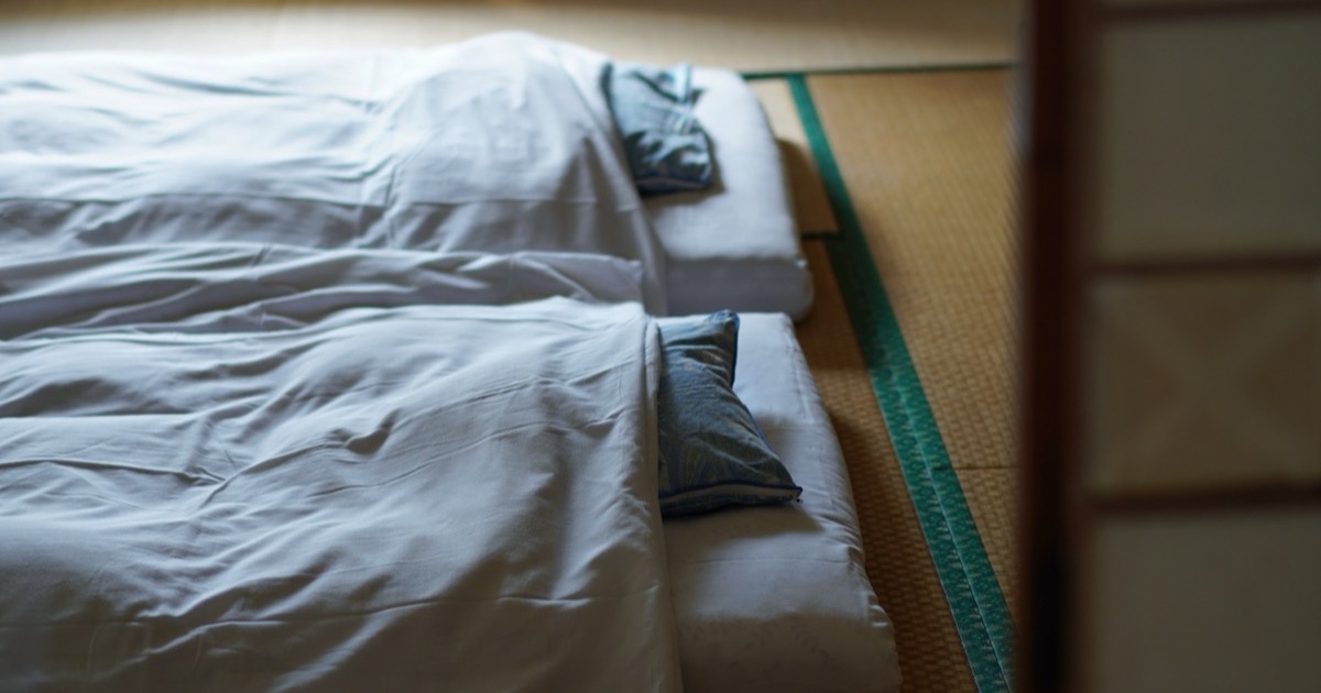 Futons laid out on tatami in a temple guest room