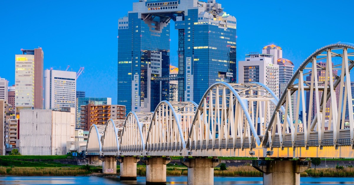 Umeda Sky Building rising over the Yodo river
