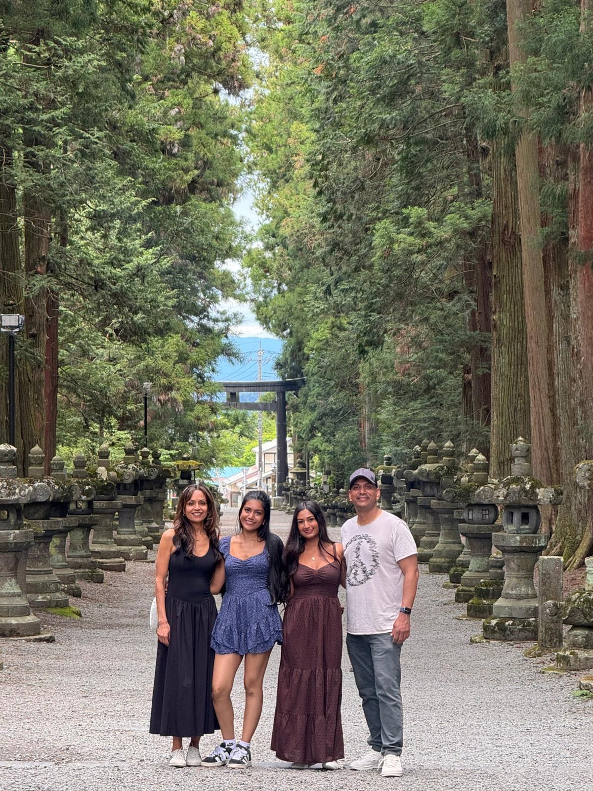 The family on a lantern-lined shrine approach