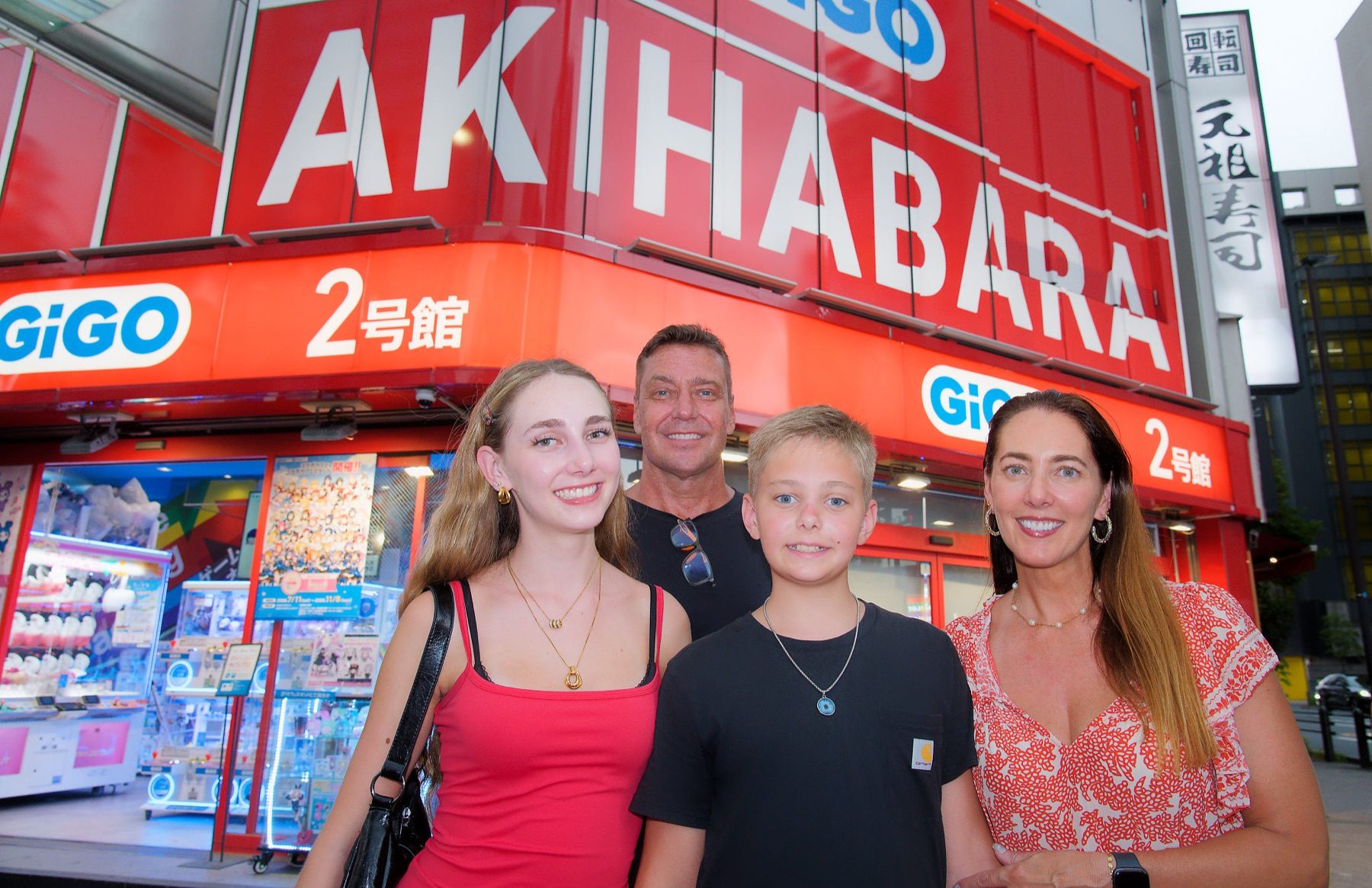 The family in front of an arcade in Akihabara