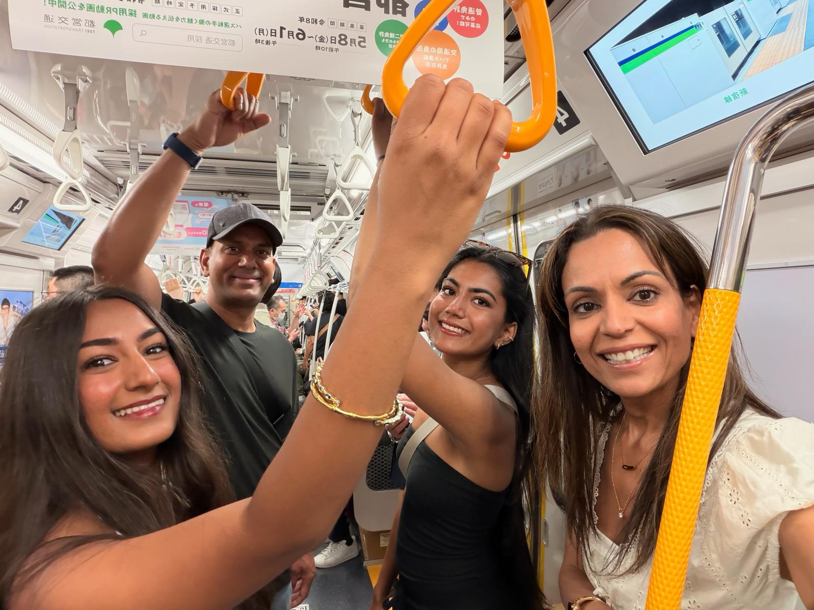 A family riding the Tokyo metro